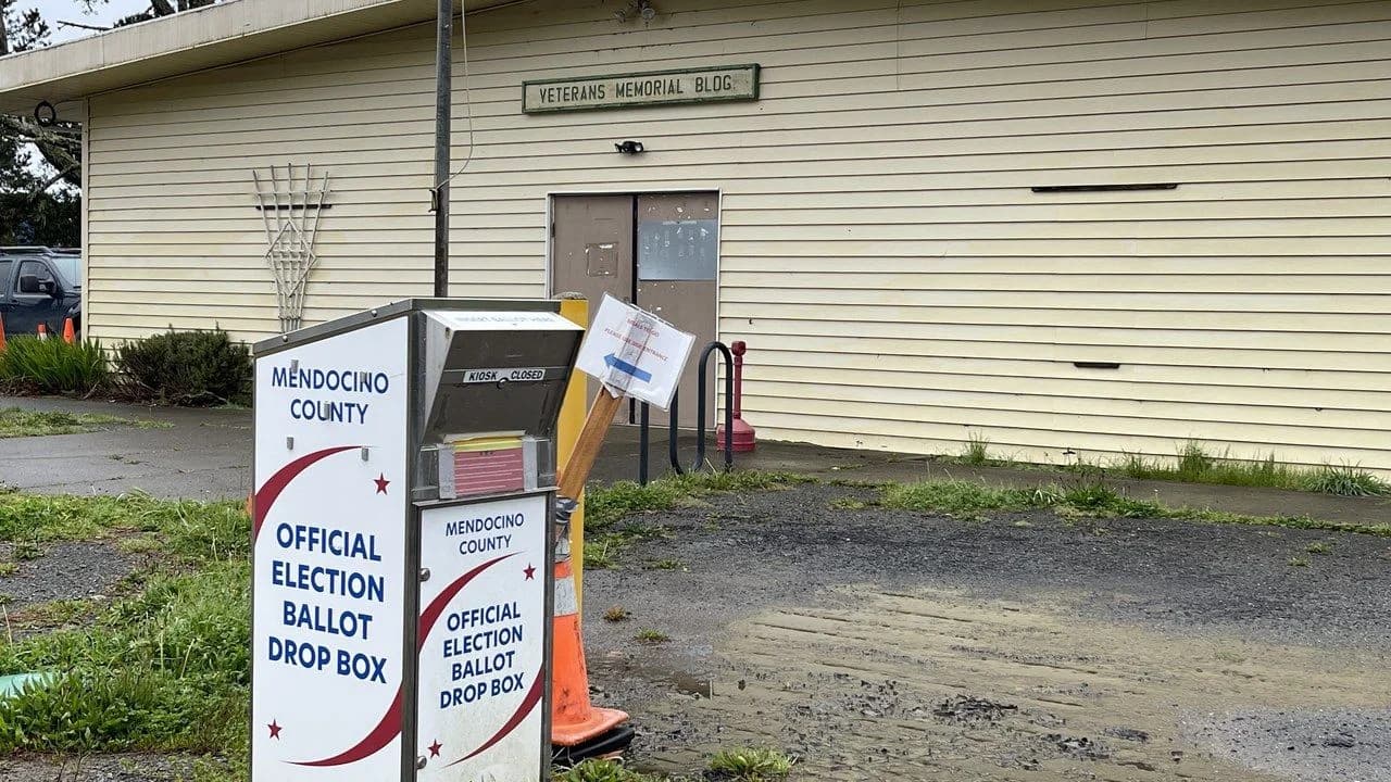 An official election ballot drop box outside a municipal building; no people visible